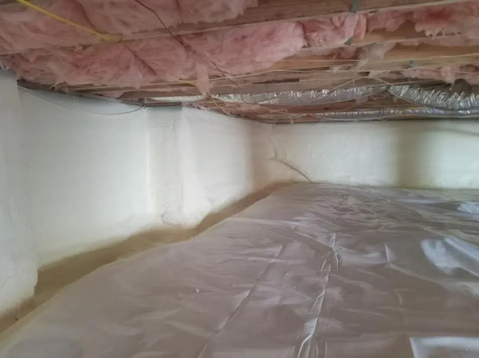 Crawl space encapsulation with closed-cell spray foam for Commercial Roof Restoration in Havelock